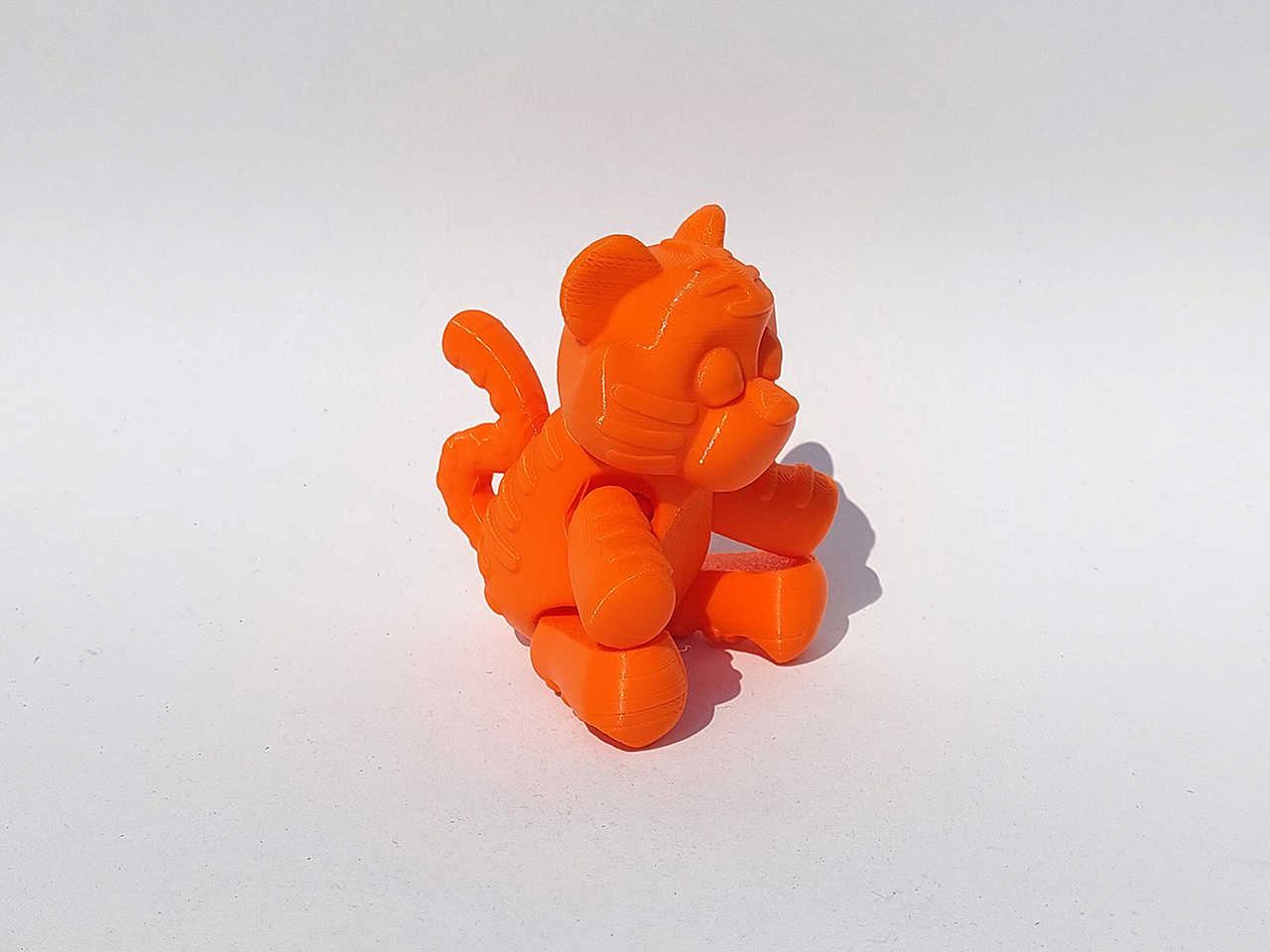 Tigriukas lankstus telefono laikiklis 12013-2